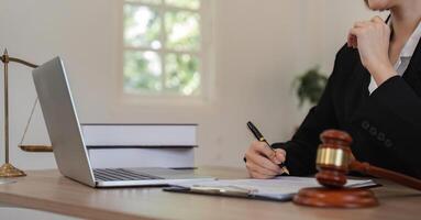 Young Lawyer Introducing and Signing Contract Documents with Clients in a Modern Office Setting photo