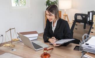 Young Lawyer Introducing and Signing Contract Documents with Clients in Modern Office Setting photo