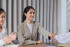 Business Professionals Engaging in Discussion and Idea Exchange in a Modern Office Setting photo