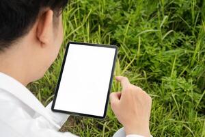Agricultural Researchers Utilizing Modern Technology in Field for Enhanced Crop Management and Data Analysis photo