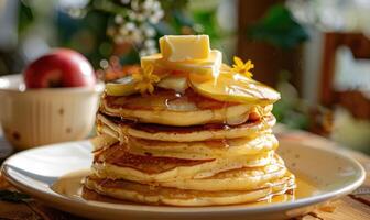 Apple jam on a stack of pancakes with butter melting on top photo