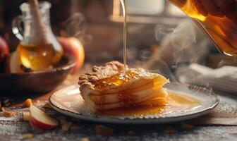 Apple syrup being poured over a slice of apple pie photo