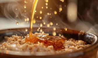Apple syrup being poured over oatmeal photo