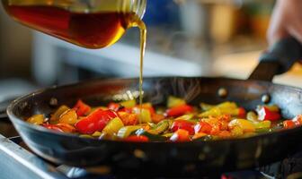 Apple syrup being used as a glaze for roasted vegetables photo