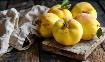 Close-up of fresh quince on a wooden board photo