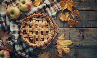 Apple pie on a rustic wooden table photo