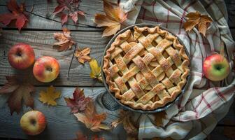 Apple pie on a rustic wooden table photo