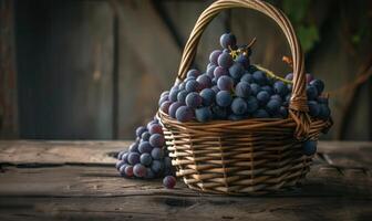 Grapes in a handcrafted wicker basket on a rustic table photo