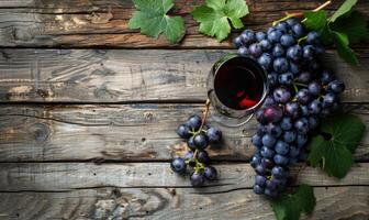 Grapes on a rustic burlap cloth with a glass of red wine photo