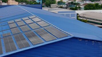 Worker Technicians are working to construct solar panels system on roof. Installing solar photovoltaic panel system. Men technicians carrying photovoltaic solar modules on roof. video