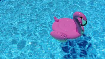 Inflatable Pink Flamingo Swim Loop Floats in the Pool in Summer, Top View video