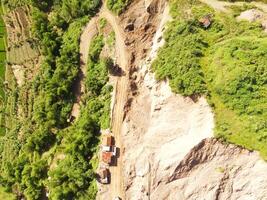 Aerial shot of Mount Padakasih slopes damaged by sand mining. Mining Industry. Panoramic Landscape. Graphic Resources. Selective Focus. Aerial Landscape Photography Concept photo