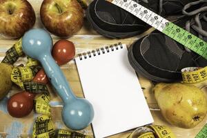 fruit for weight loss with measuring tape and equipment for exercise and diet, weight loss photo