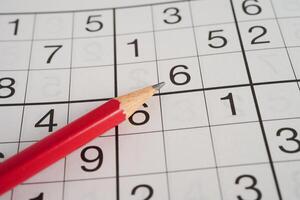 Sudoku puzzle, game to play for keep you brain younger for developing Alzheimer disease in senior patient. photo