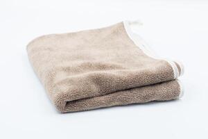 Clean bathroom towels laid out in rows, Rolled soft terry towel , Folded soft terry towel. photo