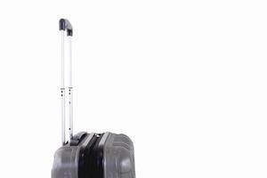 Side view of a gray travel luggage with with pull out handle, on a white background photo