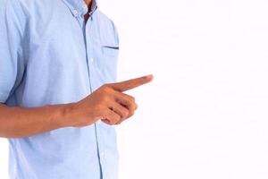 Man with a pose or gesture pointing at something on a white background photo