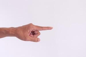 A man's hand with a pose or gesture pointing at something on a white background photo