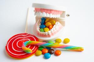 Sweet food and candy It cause tooth decay and root inflammation. photo