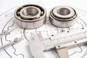 Engineering tools and mechanical industrial with vernier caliper and metal ball bering. photo