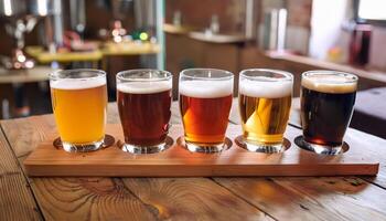 A flight of craft beers on a wooden tray photo