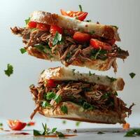 a sandwich with meat and vegetables on it being lifted photo