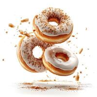 three donuts with icing and sprinkles on them photo