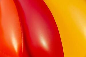 Abstract background of bright colourful plastic playground photo