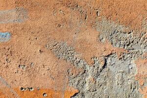 Old plaster on the facade of a building. photo