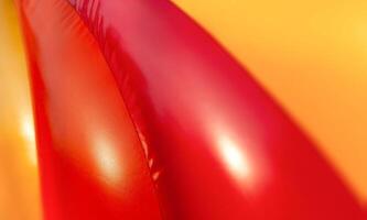 Abstract background of bright colourful plastic playground photo