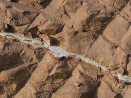 Rock surface from machine drilling photo