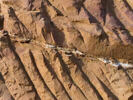 Rock surface from machine drilling photo