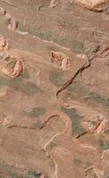 Red stone surface with pattern photo