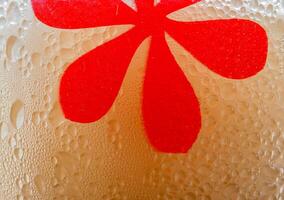 Drops of ice on an iced coffee glass photo