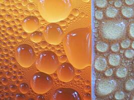 Drops of ice on an iced coffee glass photo