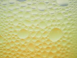 Drops of ice on an iced coffee glass photo