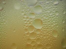 Drops of ice on an iced coffee glass photo