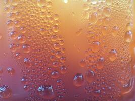 Drops of ice on an iced coffee glass photo