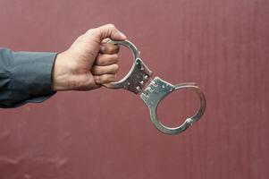Police demonstrate the use of handcuffs photo