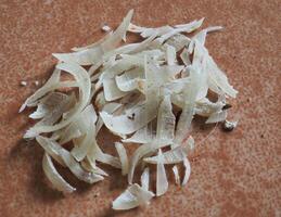 Clipped fingernails and toenails piled up in clumps. photo