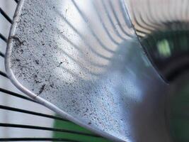 Dust and rust on fan blades and grilles photo