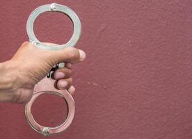 Police demonstrate the use of handcuffs photo