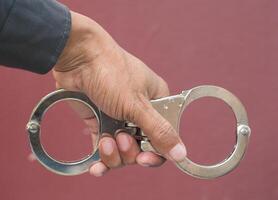 Police demonstrate the use of handcuffs photo