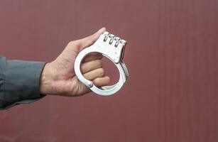 Police demonstrate the use of handcuffs photo
