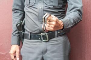 Police demonstrate the use of handcuffs photo