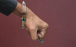 Police demonstrate the use of handcuffs photo