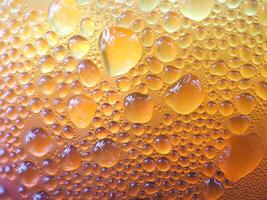 Drops of ice on an iced coffee glass photo