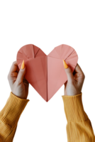 hands holding a paper heart, isolated against a transparent background png