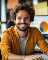 Smiling man works attentively at his desk surrounded by charts and a warm office atmosphere photo