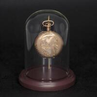 old pocket watch a family heirloom from several generations ago in its display case photo